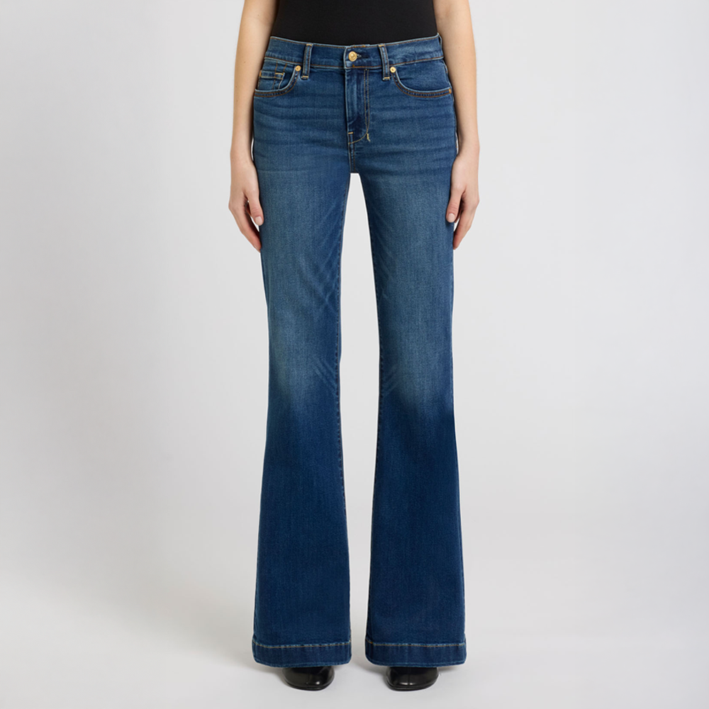  DOJO Melrose flared jeans worn by a person on a white background