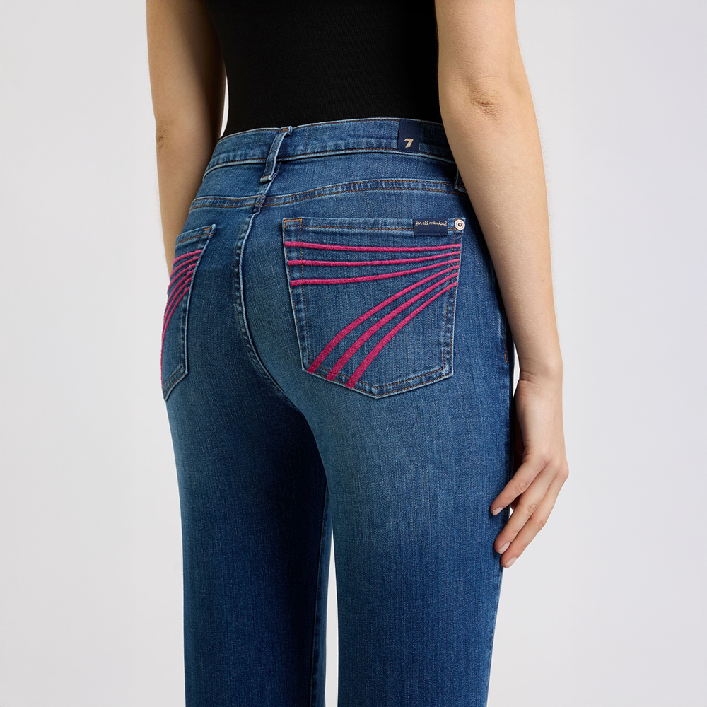 DOJO Moonwater Blue jeans with pink stitching on a plain background